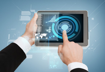 close up of man hands touching tablet pc
