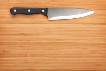 Kitchen knife on cutting board
