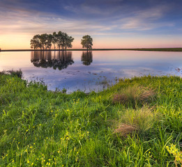 Fototapeta na wymiar Colorful spring landscape on the lake