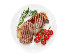 Sirloin steak with rosemary and cherry tomatoes on a plate