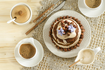 White chocolate cake with hazelnuts and cream