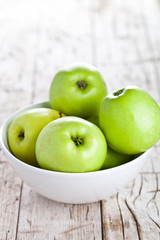 ripe green apples in bowl