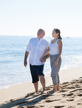 Couple Walking By The Hand