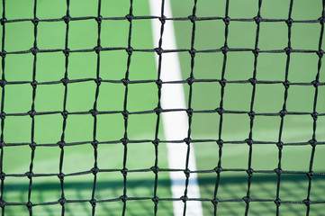 close up of tennis court net black and green