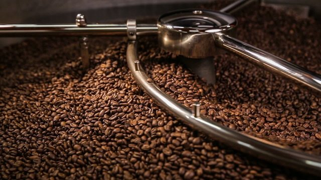 Mixing roasted coffee