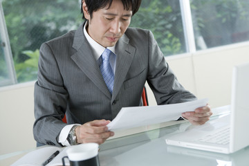 businessman checking documents