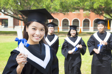 smiling college graduate show a diploma