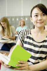 female student studying in classroom