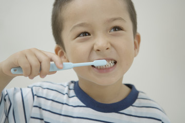 boy brushing his teeth
