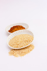 Spice powder and pepper on white background.