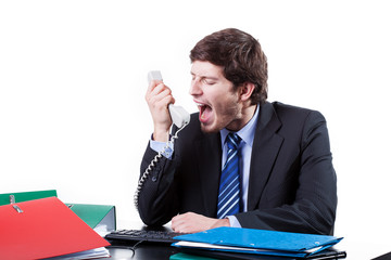Businessman shouting to phone