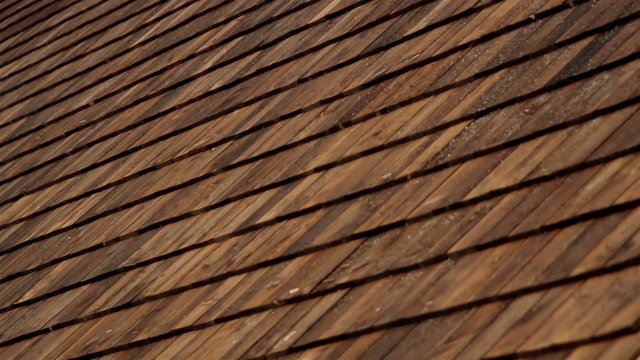Closer image Cedar wooden shingles roof roofing roofworking tar