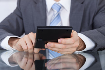 Businessman Working With A Calculator