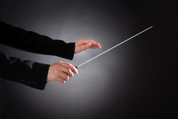 Female Orchestra Conductor With Baton