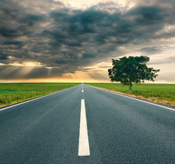 Driving on an empty highway through the corn fields