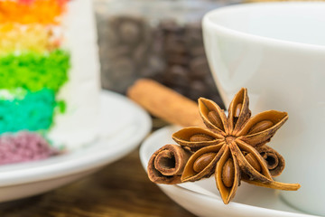 Close-up of anise stars and cinnamon sticks on wood background