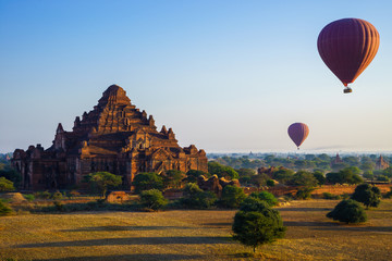 Balloon over Dhammayangyi temple at sunrise,  Bagan, Myanmar