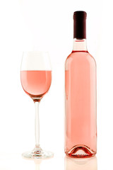 Bottle and glass of rose wine isolated