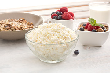 Breakfast of muesli with milk and berries