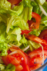 Fresh lettuce and tomato salad in the table, ready to meal