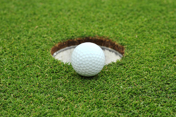 golf ball on lip hole
