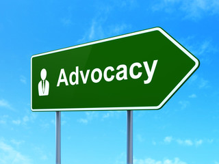 Law concept: Advocacy and Business Man on road sign background