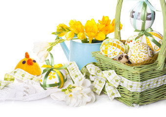 Easter eggs in green basket with chickens from felt