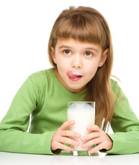 Cute little girl showing milk moustache