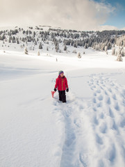 Fototapeta na wymiar little girl in snow with sledge