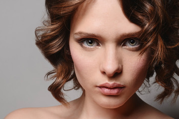 Fototapeta premium young beautiful girl with clean skin of the face. Pretty female