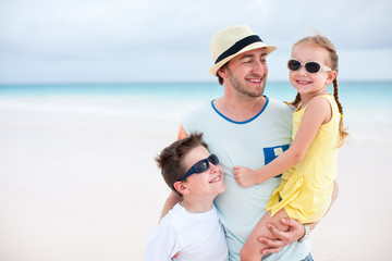Father with kids at beach