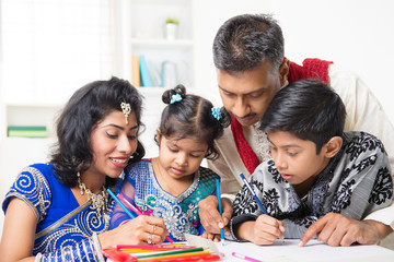Indian family painting picture at home