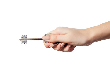 Female hand holding a key to the house