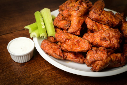 Chicken Buffalo Wings with Celery Sticks and Blue Cheese Dressin