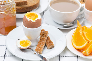 fresh breakfast with eggs, toast and coffee with milk