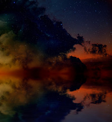 Obraz na płótnie Canvas Nebula and stars reflected in water surface.