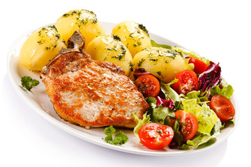 Grilled steak, boiled potatoes and vegetable salad