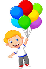 Young boy flying with balloon