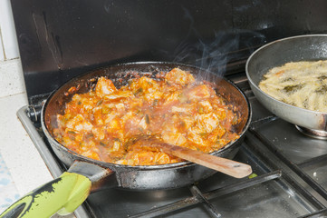 cooking meat with sauce