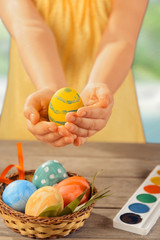 Fototapeta na wymiar Child holds Easter egg