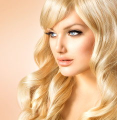 Beauty Blonde Woman. Beautiful girl with long curly blond hair