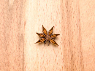 Star anise on a wooden background