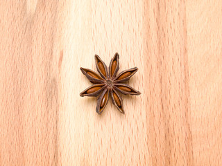 Star anise on a wooden background