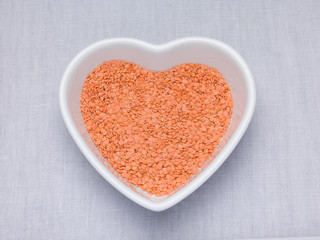 Red lentils, Petite crimson lentils in an heart shaped bowl