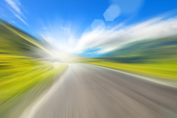 road in the mountains, a blurred image with sunlight