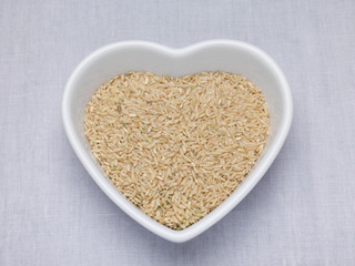 Brown rice in a heart shaped bowl