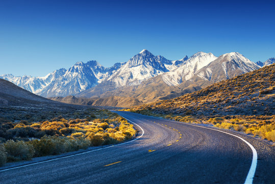 Highway / Road In USA Desert With Mountains