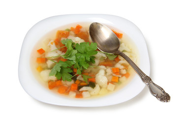 Vegetable soup and spoon