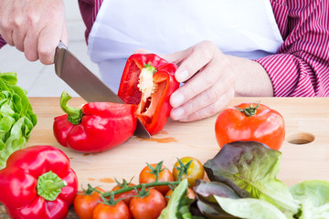Man cutting vegetables for healthy salad