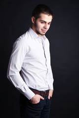 Handsome young man on dark background